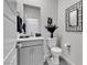 Charming half-bathroom featuring modern vanity with a mirror and decor, as well as contemporary fixtures at 4267 E Highvale Ct, Pahrump, NV 89061