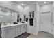 Elegant bathroom with a double vanity, a shower and a sleek design at 4267 E Highvale Ct, Pahrump, NV 89061