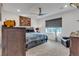 Bedroom with a window, ceiling fan, and wood furniture at 4267 E Highvale Ct, Pahrump, NV 89061