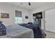 Cozy bedroom with neutral tones, queen-sized bed, and mounted TV creating a relaxing retreat at 4267 E Highvale Ct, Pahrump, NV 89061