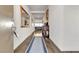 Bright entryway with hardwood floors, decorative mirrors, and an antique console table at 4267 E Highvale Ct, Pahrump, NV 89061