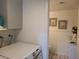 Well-lit laundry room with stacked washer and dryer at 4537 Buena Vista Dr, Las Vegas, NV 89102