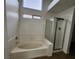 Clean bathroom featuring a tub with shower and natural light at 4610 Cannon Beach St, Las Vegas, NV 89122