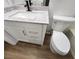 Bathroom featuring a granite vanity top and drawers, next to a toilet at 4610 Cannon Beach St, Las Vegas, NV 89122