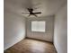 Bedroom with a ceiling fan and window at 4610 Cannon Beach St, Las Vegas, NV 89122