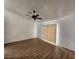 Spacious bedroom featuring hardwood floors, a ceiling fan, and bright natural light at 4610 Cannon Beach St, Las Vegas, NV 89122