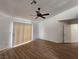 Large bedroom with plenty of natural light, hardwood floors, and a ceiling fan at 4610 Cannon Beach St, Las Vegas, NV 89122