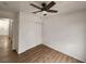 Bright bedroom with ceiling fan, white walls, and wood-look flooring at 4610 Cannon Beach St, Las Vegas, NV 89122