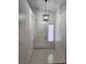 Bright foyer with tiled flooring, high ceilings, and a modern light fixture creates a welcoming entrance at 4610 Cannon Beach St, Las Vegas, NV 89122