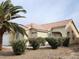 Well-maintained property with mature landscaping, including desert shrubbery and a tile roof at 4610 Cannon Beach St, Las Vegas, NV 89122