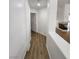 Hallway view to living room with modern floors and white walls at 4610 Cannon Beach St, Las Vegas, NV 89122