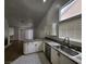 Kitchen area with stainless steel sink, dishwasher, and granite countertops at 4610 Cannon Beach St, Las Vegas, NV 89122