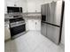 Modern kitchen with stainless steel appliances and white cabinetry at 4610 Cannon Beach St, Las Vegas, NV 89122