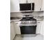 Stainless steel gas range and microwave with granite countertops at 4610 Cannon Beach St, Las Vegas, NV 89122