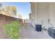 Landscaped backyard with gravel and central AC units at 4793 Cannon Hill Ct, Las Vegas, NV 89130