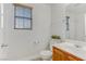 Bathroom features wood vanity, toilet, and window at 4793 Cannon Hill Ct, Las Vegas, NV 89130