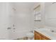 Clean bathroom with tub, toilet and wood vanity at 4793 Cannon Hill Ct, Las Vegas, NV 89130