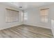 Spacious bedroom with light wood floors and window blinds at 4793 Cannon Hill Ct, Las Vegas, NV 89130