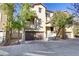 Three-story townhome with attached garage and front yard at 4793 Cannon Hill Ct, Las Vegas, NV 89130