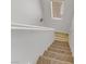 Stairs with carpeted steps and wood flooring at 4793 Cannon Hill Ct, Las Vegas, NV 89130