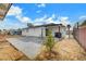 Large backyard patio and grassy area at 6520 Evergreen Ave, Las Vegas, NV 89107