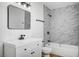 Updated bathroom with white vanity, marble shower, and modern fixtures at 6520 Evergreen Ave, Las Vegas, NV 89107