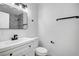 Modern bathroom with white vanity and marble-tiled shower at 6520 Evergreen Ave, Las Vegas, NV 89107