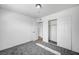 Spacious bedroom with grey carpet and mirrored closet doors at 6520 Evergreen Ave, Las Vegas, NV 89107