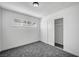 Spacious bedroom with gray carpet and mirrored closet doors at 6520 Evergreen Ave, Las Vegas, NV 89107