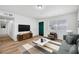 Spacious living room featuring wood floors and ample natural light at 6520 Evergreen Ave, Las Vegas, NV 89107