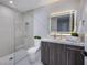 Contemporary bathroom with gray vanity, white marble countertop and shower with glass door at 658 Dragon Peak Dr, Henderson, NV 89012