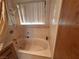 Clean bathroom with an oval bathtub and shower at 671 Bourbon St # H2, Pahrump, NV 89048