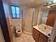 Bathroom with shower, toilet, and vanity at 671 Bourbon St # H2, Pahrump, NV 89048