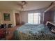 Primary bedroom with a double bed and access to outside at 671 Bourbon St # H2, Pahrump, NV 89048