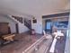 Living room with staircase and partial kitchen view at 671 Bourbon St # H2, Pahrump, NV 89048