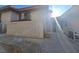 Private side yard with block wall and seating area at 671 Bourbon St # H2, Pahrump, NV 89048