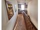 Upstairs hall with built-in desk and stairway at 671 Bourbon St # H2, Pahrump, NV 89048