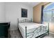 Bright bedroom featuring a queen bed and wood-look floors at 700 Carnegie St # 4812, Henderson, NV 89052