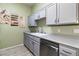 Modern gray kitchen with stainless steel appliances at 700 Carnegie St # 4812, Henderson, NV 89052