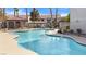 Inviting kidney-shaped pool with a spa and surrounding deck at 700 Carnegie St # 4812, Henderson, NV 89052