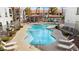 Relaxing pool area with lounge chairs and a shaded seating area at 700 Carnegie St # 4812, Henderson, NV 89052