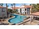 Kidney shaped pool with a spa, and plenty of lounge chairs at 700 Carnegie St # 4812, Henderson, NV 89052