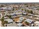 An aerial view showcases the home in a neighborhood with easy access to shopping and main streets at 704 Berry Cir, Las Vegas, NV 89107