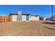 Low maintenance backyard with rock features a shed with a small grassy area at 704 Berry Cir, Las Vegas, NV 89107