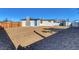 Large backyard features low maintenance gravel and a view of the shed at 704 Berry Cir, Las Vegas, NV 89107