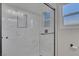 Close up of newly remodeled bathroom with a glass shower door and hexagon tile accent in shelving at 704 Berry Cir, Las Vegas, NV 89107