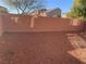 Small backyard with gravel ground cover and block wall at 7155 Steele Canyon St, Las Vegas, NV 89118