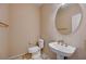 Modern bathroom with updated fixtures, a pedestal sink, and a large mirror at 752 Golden Sedum Dr, Henderson, NV 89011