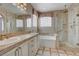 Spa-like bathroom with double vanity, soaking tub, and glass shower at 752 Golden Sedum Dr, Henderson, NV 89011