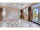 Bright bedroom with tile floors, neutral walls, and access to a balcony at 752 Golden Sedum Dr, Henderson, NV 89011